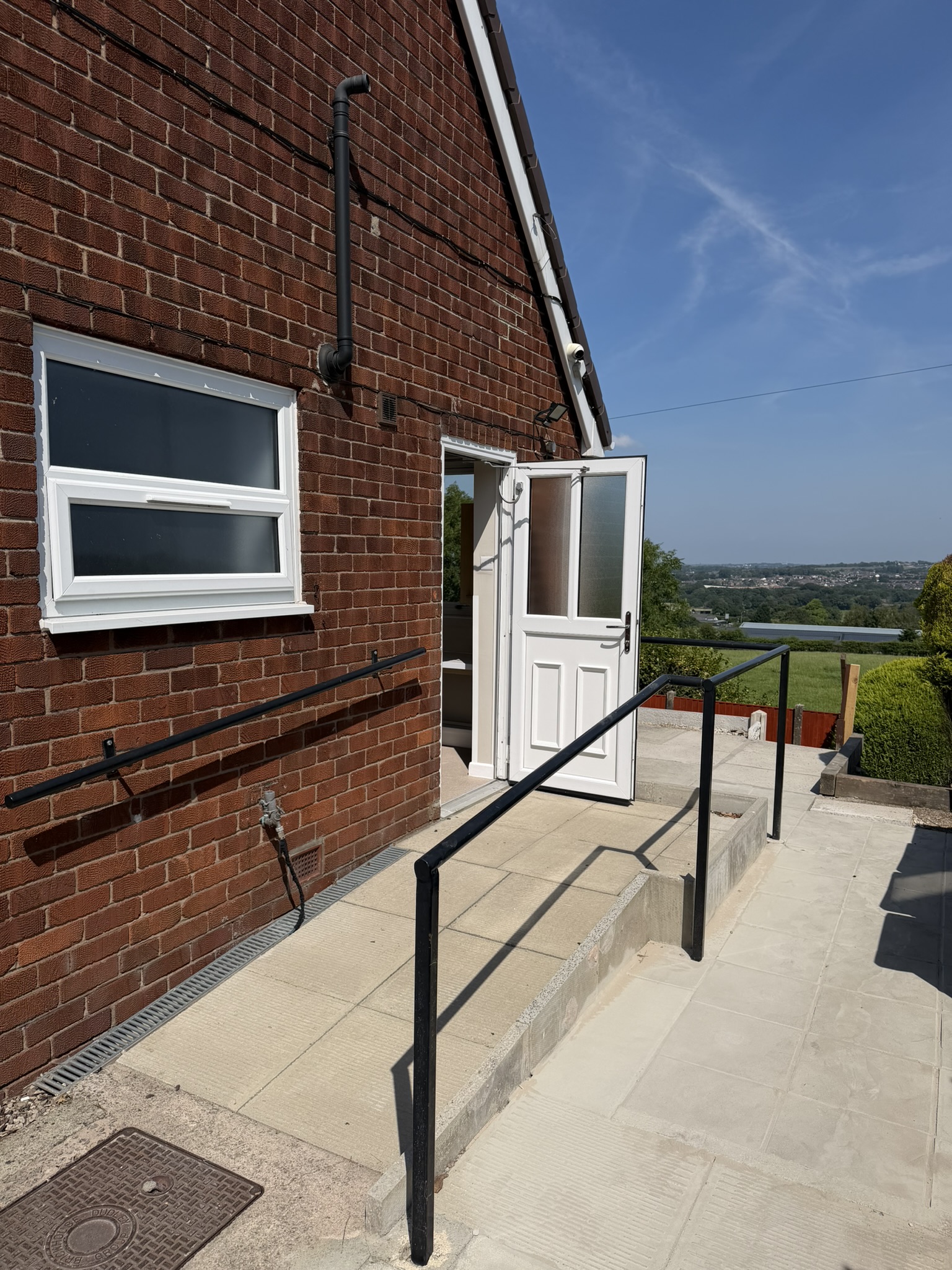 Exterior Ramped Entrance with Door Assist To rent large one bedroom wheelchair accessible property Bolton Lancashire AccessiblePRS