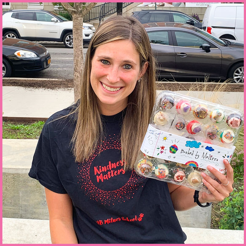 Local Teacher Holding Baked By Melissa Snack Break Cupcakes 25-Pack Local Teacher Holding Baked By Melissa Snack Break Cupcakes 25-Pack
