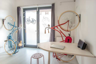 Spacious room with comfortable bed with ecological mattresses and two bikes.