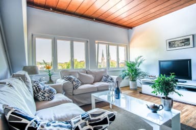 Living room with comfortable sofa and amazing view on Trnovo church.