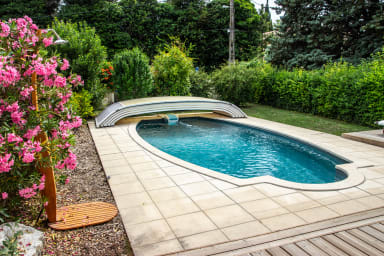 Outdoor swimming pool with wooden deck