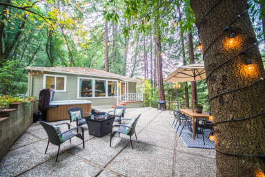 Large outdoor living space with gas fire pit, outdoor dining, gas grill, and...