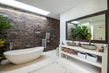 Private bathroom of bedroom 1 with its bathtub.