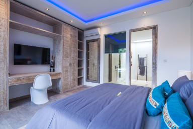 view from the bedroom 3 onto the tv, dressing and bathroom