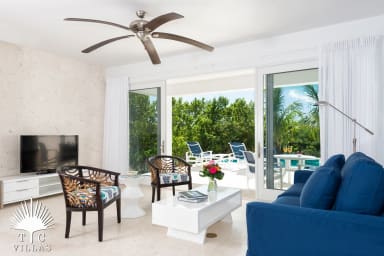 Little Plum's living room with direct access to the private pool.