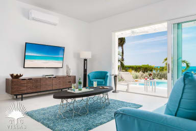 Villa Sandpiper's living room opens to the private pool.