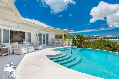 Turtle Beach VIlla's private pool and lounging chairs.