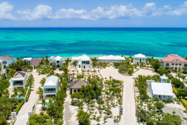 Aerial view of Coriander Cottage facing Grace Bay Beach.