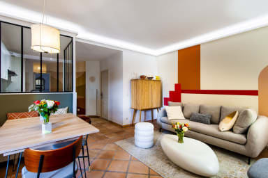 Comfortable living room with convertible sofa, TV