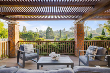 Front porch with outdoor seating and views!