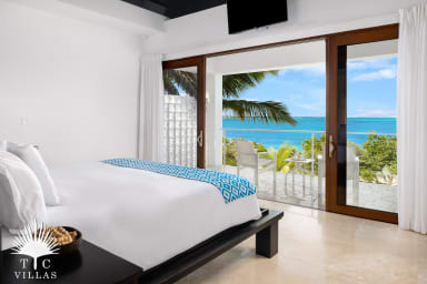 Master suite with balcony and beach views.