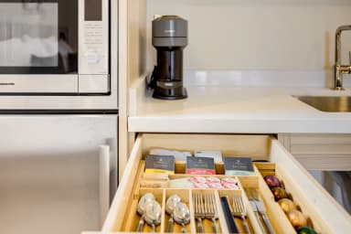Essentials provided: Vertuo Coffe Pods, Tea, and bottle opener.