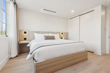 King-size bed, sleeps 2, seating area, and 65