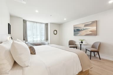 King-size bed, sleeps 2, seating area, and 65