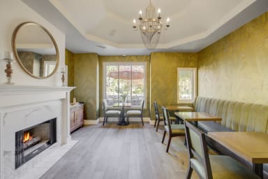 Your cozy spot: A first-floor common area with a fireplace.