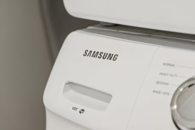 In-unit laundry room with a full-size washer and dryer.