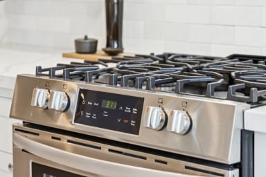 Full kitchen: Nespresso, fridge, stove/oven, plates and utensils, dishwasher