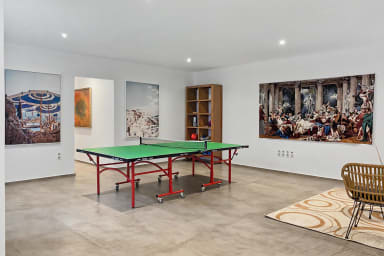 Challenge friends to a game of ping pong in your private indoor playroom.