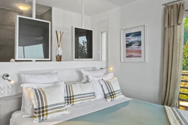 Tranquil bedroom with workspace—ideal for work and coastal relaxation combined.