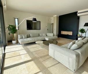 The lounge extends seamlessly onto the panoramic terrace.