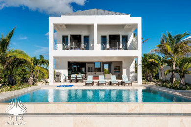 Miami Vice Two's private pool with loungers and outdoor dining table. 