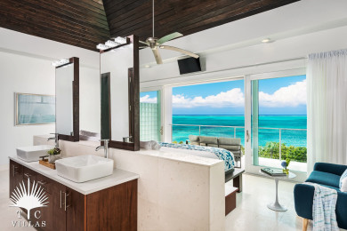 Sandpebble's master bedroom grants guests iconic views over Grace Bay Beach.