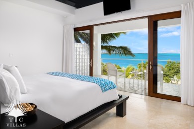 Master suite with balcony and beach views.
