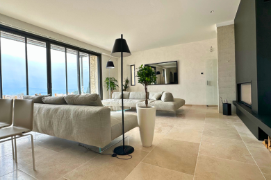 The lounge extends seamlessly onto the panoramic terrace.