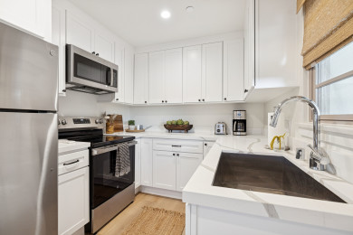 Full kitchen: Coffee drip, fridge, stove/oven, plates and utensils, dishwasher