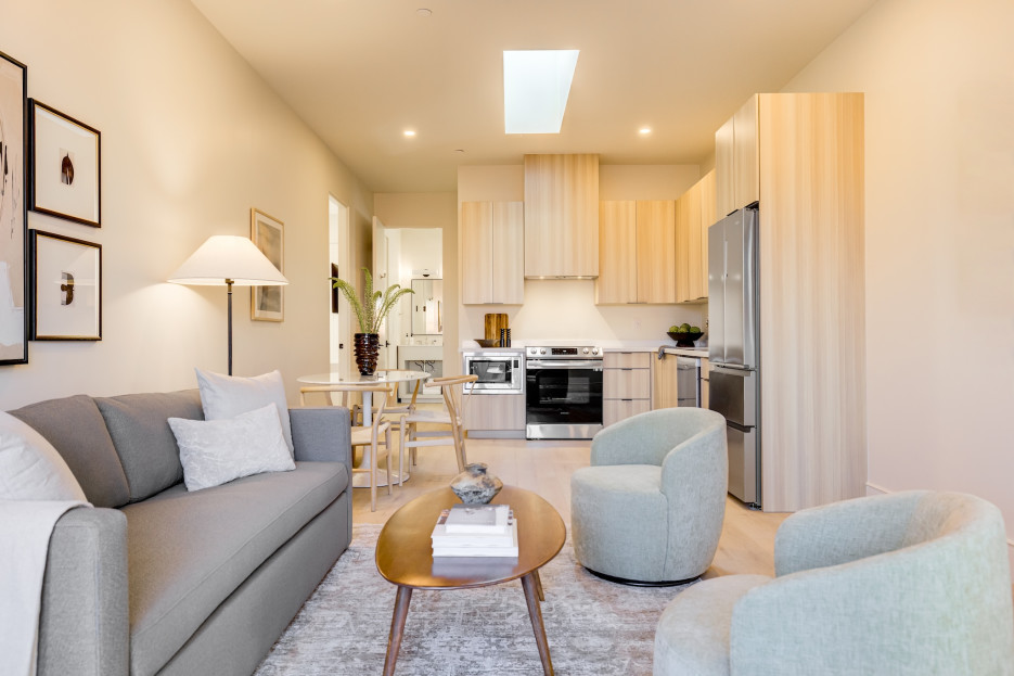 Seating area with sofa and lounge chairs.