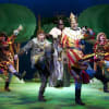 Marcus Brigstocke as King Arthur, Todd Carty as Patsy and the cast of Monty Python's Spamalot