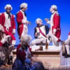John Hollingworth (centre in blue) and the cast