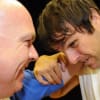 Wrestler Gary Davison (L) teaching actor Micky Cochrane (R) some wrestling moves