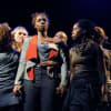 Rebecca Omogbehin (centre) as Bounty