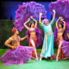 Barry Humphries as Dame Edna Everage with the ensemble