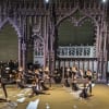 Students from the Rambert School of Ballet and Contemporary Dance on stage with Garsington Opera Orchestra and Chorus