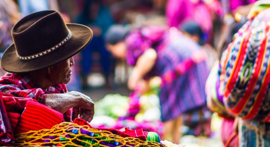 Enchanting Travels Guatemala Tours View on old maya man on market in Chichicastenango