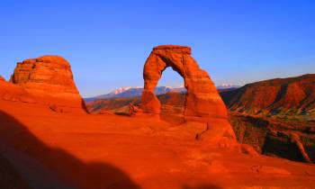 a canyon with Arches National Park in the background