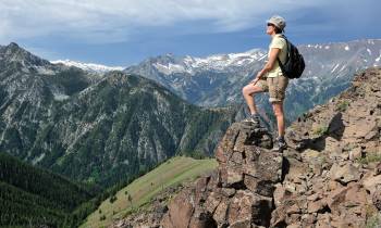 a man standing on top of a mountain