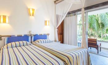 a bedroom with a large bed in a room
