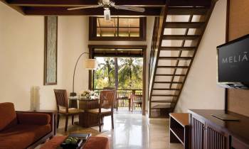 a living room filled with furniture and a large window