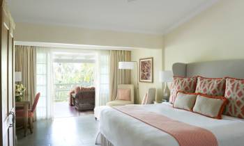 a bedroom with a large bed in a hotel room