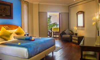 a bedroom with a bed in a room