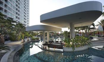 a large building with a pool