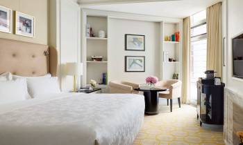 a bedroom with a large bed in a room