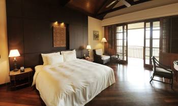 a bedroom with a large bed in a hotel room