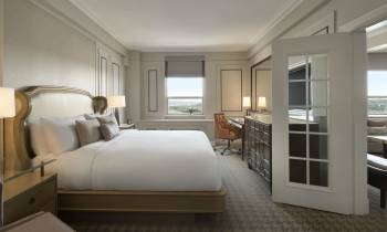 a bedroom with a large bed in a room