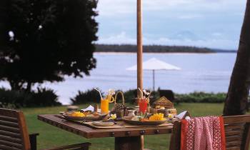a wooden bench in front of a body of water