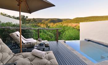 a bedroom with a large umbrella