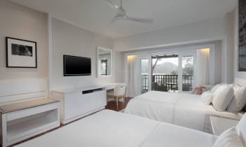 a bedroom with a large bed in a hotel room